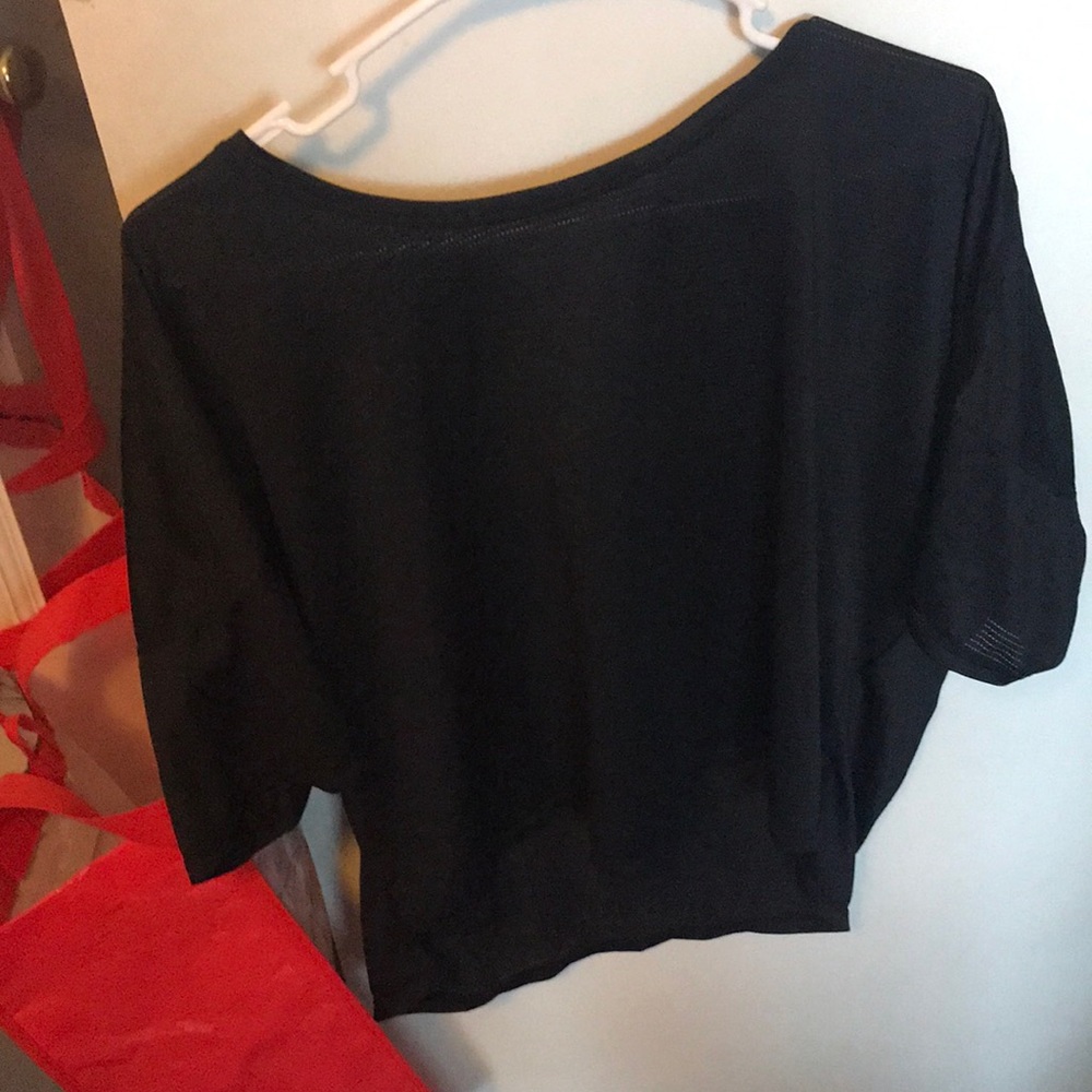 A black wide cut jersey sports top